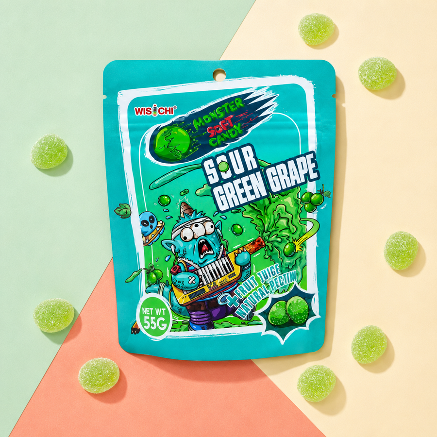 A 55g pouch of Wischi Monster Soft Candy Sour Green Grape, featuring a bright teal background with a cartoon character playing a keyboard and green grape graphics, surrounded by scattered green grape candies on a pastel geometric background.